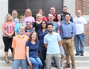 Math Division Staff on the front steps of West Chicago Community HIgh School.